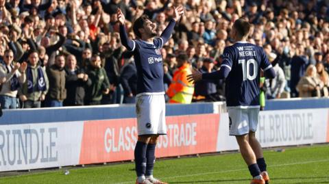 Mihailo Ivanovic (left) celebrates scoring for Millwall against Preston North End