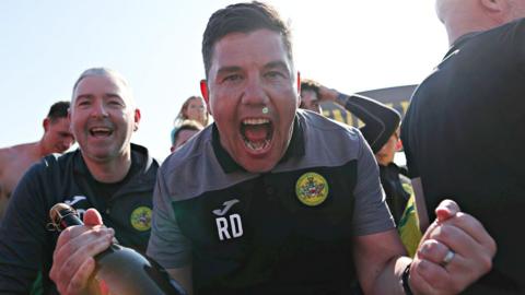 Richard Davies celebrates Caernarfon's Play-Off final victory