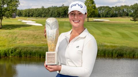 Darcey Harry poses with her trophy