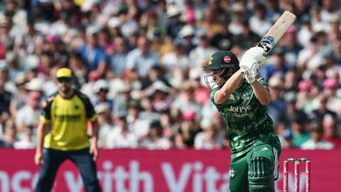 Joe Clarke batting for Notts with a Hampshire fielder in the deep