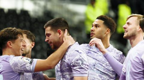 Swansea players celebrate Zan Vipotnik's goal at Derby last month