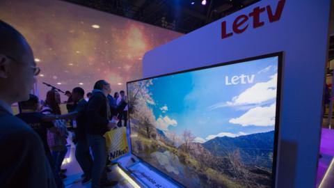 People look at the Letv 120-inch UHD 4K panel, January 9, 2016 in Las Vegas, Nevada at the CES 2016 Consumer Electronics Show