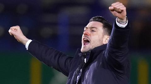 Charlton boss Johnnie Jackson celebrates his side's win at Portsmouth