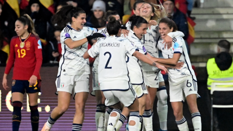 Italy's players celebrate after scoring against Spain