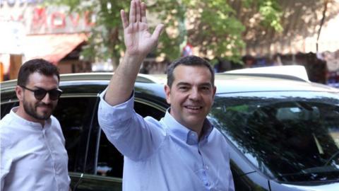 Alexis Tsipras waves to reporters in Athens, Greece. Photo: 29 June 2023
