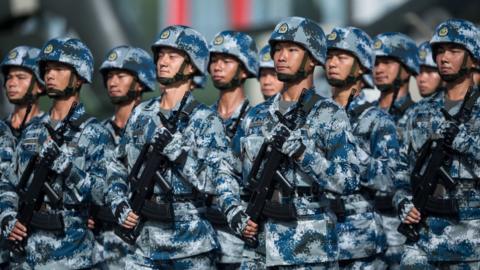 People's Liberation Army soldiers prepare for the arrival of China's President Xi Jinping at the Shek Kong barracks in Hong Kong on 30 June 2017