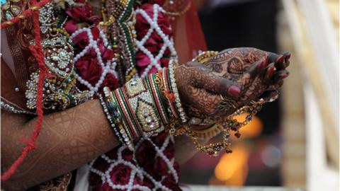 A Hindu Jain bride in a mass wedding ceremony at the Karnawati Club in Ahmedabad on February 2, 2014