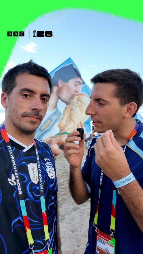 Argentina fans Chicho and Tomi. They are both wearing dark blue Argentina away shirts.