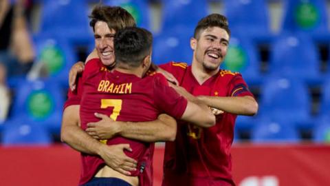 Spain celebrate their goals against Lithuania