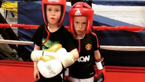two boys boxing