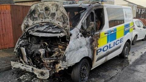 The fire-damaged Cleveland Police van