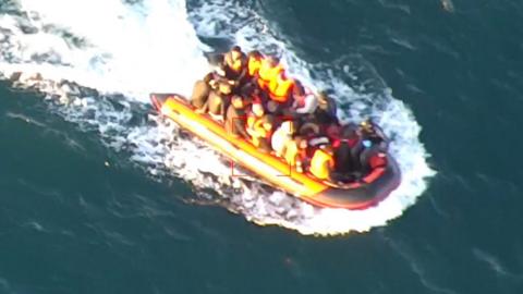 Small boat loaded with migrants in English Channel