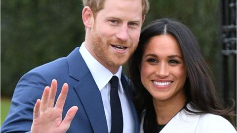 Meghan Markle and Prince Harry pose after engagement