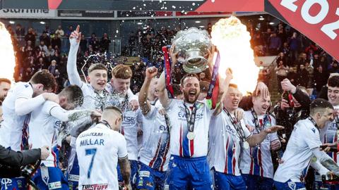 Jamie Mulgrew lifts the BetMcLean Cup