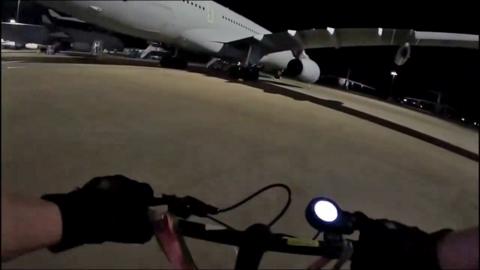 A still from footage on social media showing a person on a scooter at the runway 