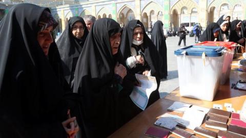 Veiled Iranian women cast their votes during the Iranian legislative election at the Abdol-Azim shrine in Shahre-Ray, southern Tehran