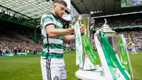 Celtic winger James Forrest with the Scottish Premiership trophy