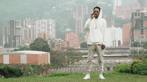 A screengrab from Instagram shows Wiz Khalifa smoking by the grave of the late Colombian drug lord Pablo Escobar