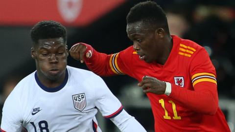 Wales' Rabbi Matondo (right) challenges Yunus Musah of the USA