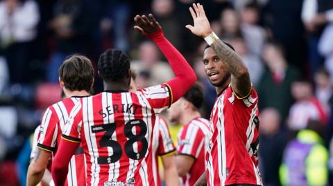 Sheffield United's Tyrese Campbell high fives Seriki Dembele