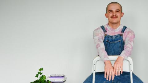 Freddie Lewis sitting on a chair