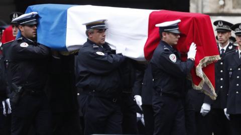 French Police officers carry a coffin during a ceremony to pay tribute to the victims of the 03 October knife attack in Paris" Police headquarters, in Paris, France, 08 October 2019.