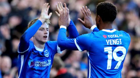 Portsmouth players celebrate a goal