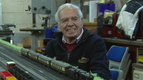 Vic Burgess infront of a model railway