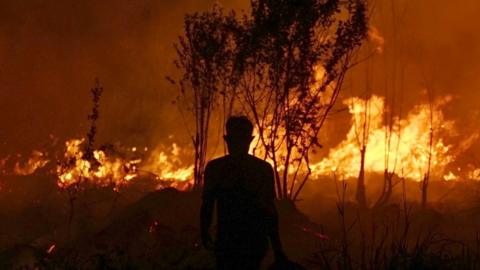 A firefighter in Ogan Ilir, South Sumatra, Indonesia