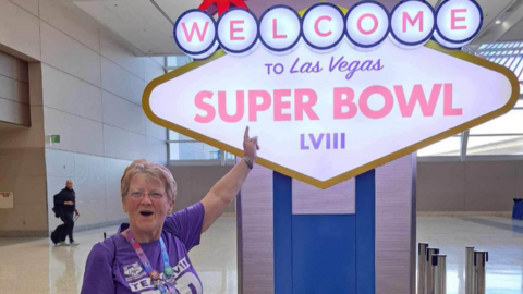 Pat Garner stood next to a superbowl sign