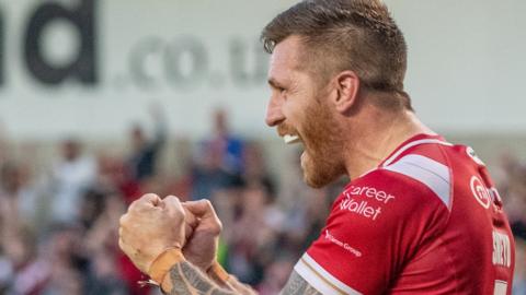 Marc Sneyd celebrates scoring the matchwinning try and goal for Salfird