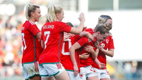 Wales players celebrate Rachel Rowe's goal