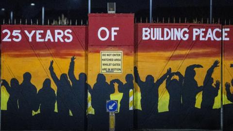 Lanark Way interface gates which allow traffic to move between the Republican and Loyalist areas of Belfast during limited times of the day has been painted ahead of the 25th anniversary of the Good Friday Agreement.