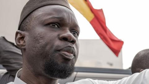 Senegal's opposition leader and presidential candidate Ousmane Sonko addresses his supporters as he went to court to attend the hearing, on March 16, 2023 in Dakar, Senegal.