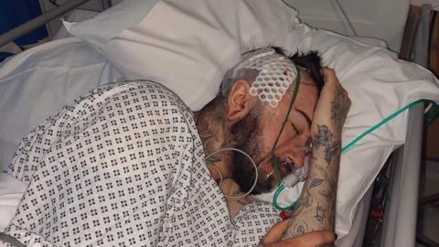 Morgan Fevre in a hospital bed after an attack