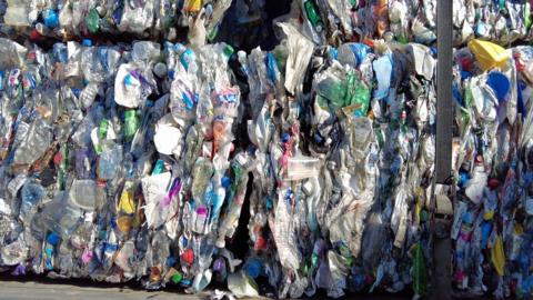 Two baled cubes of plastic botles.