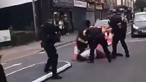 Police tackle the suspect