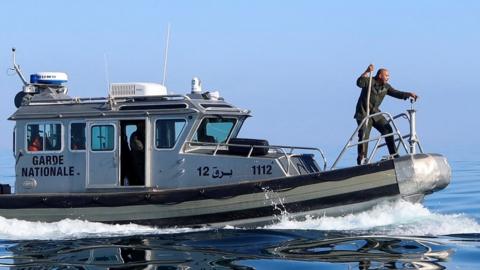 Tunisian coast guards on a boat off the coast off Sfax, Tunisia - April 2023