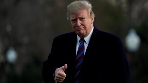 U.S. President Donald Trump thumbs up as he returns to the White House in Washington, U.S., after an annual physical test