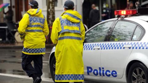 New South Wales Police Force clear a city street of protesters outside state parliament in Sydney in 2012