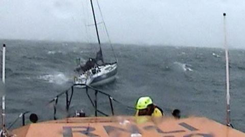 RNLI Lifeboat approaches stricken yacht