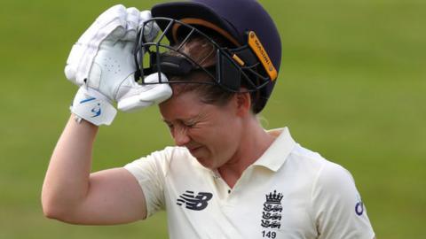 Heather Knight grimaces after being dismissed for 95