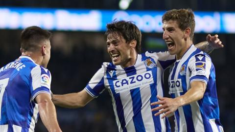 Real Sociedad's Ander Barrenetxea, David Silva and Mikel Oyarzabal celebrate scoring their second goal against Real Madrid