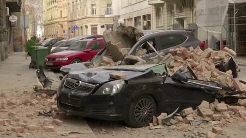 Car crushed by debris