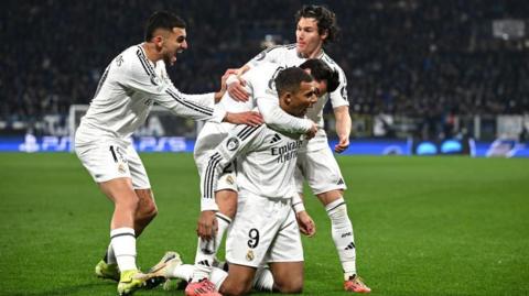 Real Madrid players celebrate scoring against Atalanta