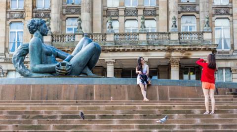 Tourists in Birmingham's Victoria Square