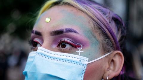 Women with painted face during International Women's Day events