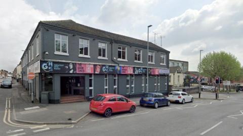 The former Signal Radio building, with cars pictured outside