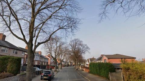 A Google street view of Central Avenue, in Hucknall. The photo is taken from the middle of the road - houses and trees can be seen both sides of the street