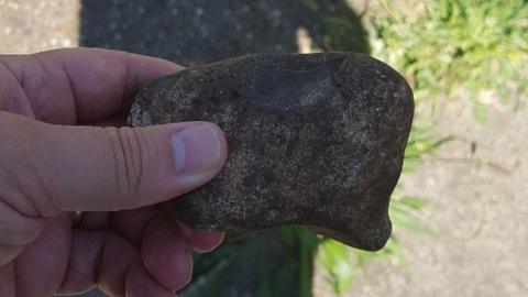 Stone fired towards police